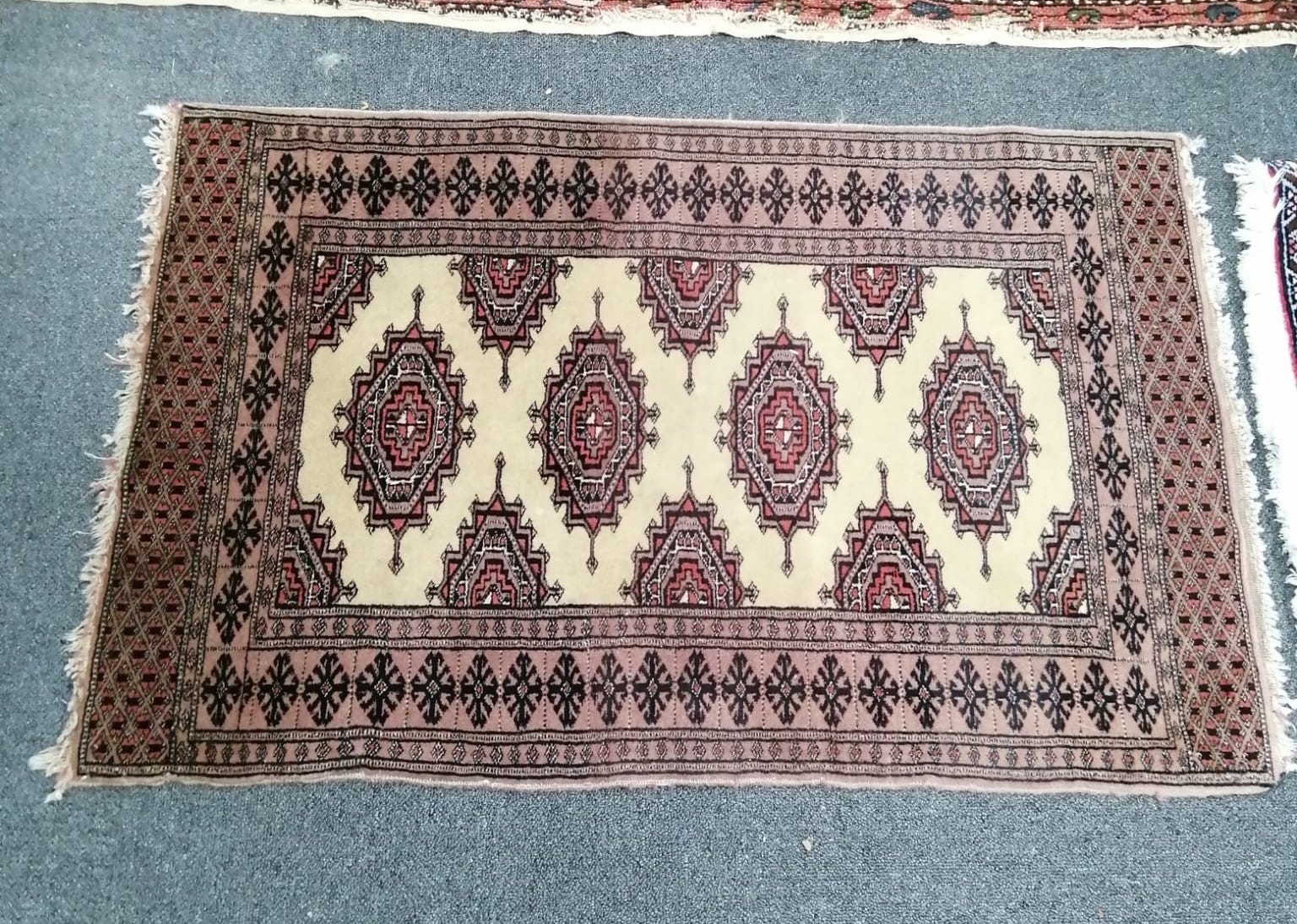 A North West Persian red ground rug, a Tabriz blue ground rug and two smaller modern rugs, largest 254 x 172cm